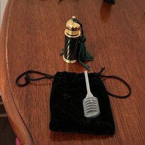 Elegant Green and Gold Perfume Bottle